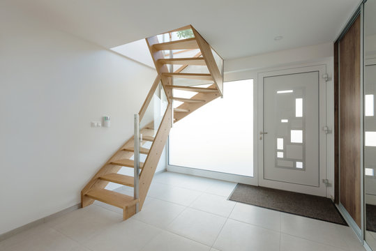 Interior of hallway with wooden stairway