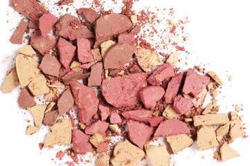 Heap of various crashed makeup products