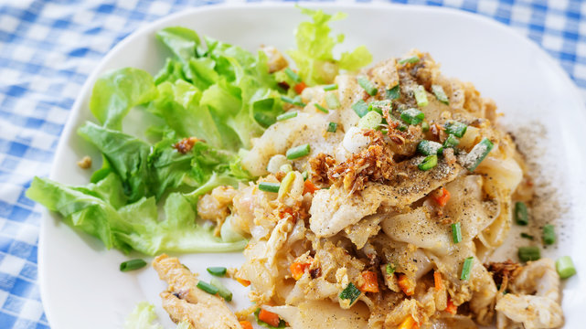 Fried noodles with chicken, (Thai food).