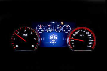 Modern light car mileage on black background 25 mph