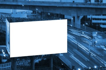 blank billboard for new advertisement at Motorway, Expressway with blurred city at night, color tone effect, copy space for text.