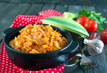 fried cabbage in bowl and on a table
