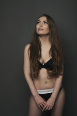Naklejka premium Woman think and looking portrait studio