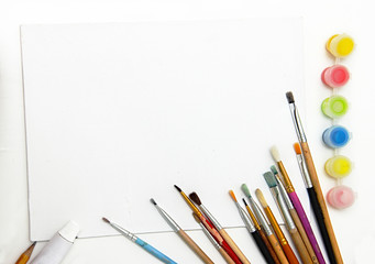 painting equipment and blank white canvas. art Background, brushes