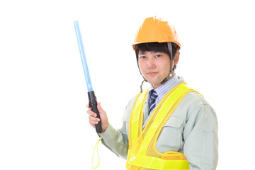 誘導灯を持つ労働者 