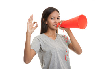 Beautiful young Asian woman  announce with megaphone.