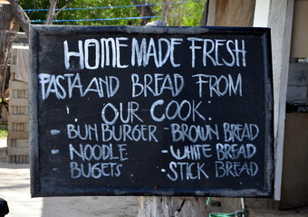 Homemade fresh pasta and bread. Cafe menu, written in chalk on a blackboard