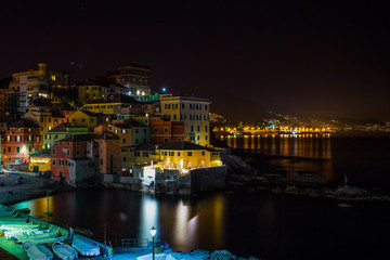 Fototapeta na wymiar GENOA (GENOVA), ITALY, MARCH 29, 2017 - Genoa (Genova) Boccadasse by night, a fishing village and colorful houses