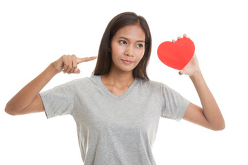 Asian woman point to red heart.