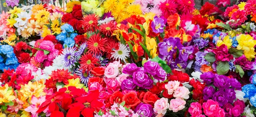  A variety of artificial flowers. Colorful background of flowers © Andrey Lapshin