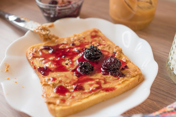 Toast with peanut butter and BlackBerry jam.