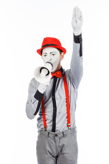 Clown, MIME, holding a Megaphone. The expression of emotions. On a white background.