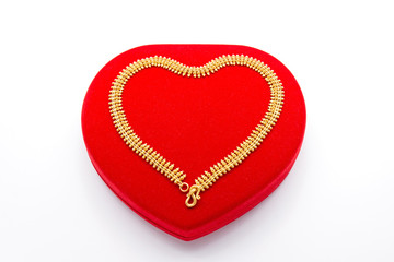 Golden Necklace on Red Heart Box