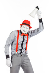 Clown, MIME, holding a Megaphone. The expression of emotions. On a white background.
