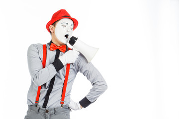 Fototapeta na wymiar Clown, MIME, holding a Megaphone. The expression of emotions. On a white background.