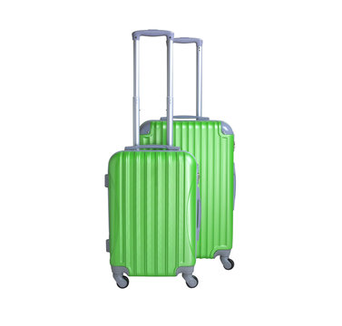Two suitcases isolated on white background. Polycarbonate suitcases isolated on white. Green suitcases.