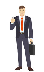 Obraz premium Businessman with mobile phone and briefcase