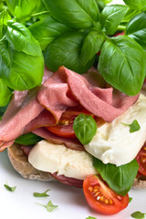 Ciabatta with ham , mozzarella, tomato and basil