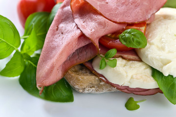 Ciabatta with ham , mozzarella, tomato and basil