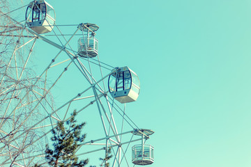 Ferris Wheel Over Blue Sky