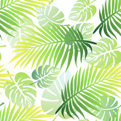 Tropical seamless pattern with palm tree leaves and exotic plant