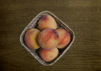 Peach fruit in a basket