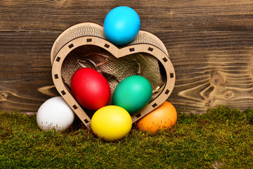 Fototapeta na wymiar easter colorful eggs in wooden heart box