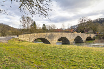 Fototapeta na wymiar stone bridge in Oberregenbach in Hohenlohe