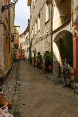 narrow street in historical village, Finalborgo, Italy