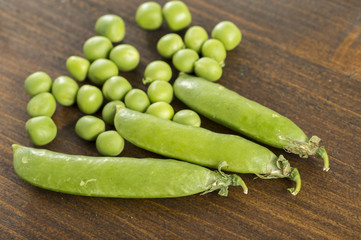 pea pods and peas on the table