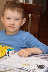 boy sitting at the table