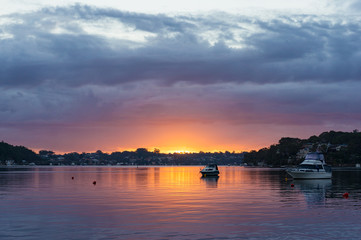 Naklejka premium Sunset, sunrise landscape with yachts on tropical lagoon