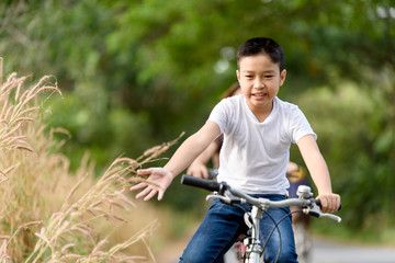 Obraz premium Boy ride bicycle