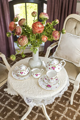 tea set on a table near the window