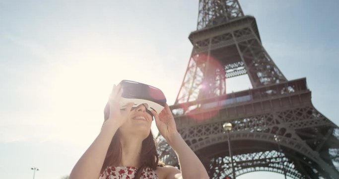 Tourist woman wearing virtual reality headset Eiffel tower Paris watching 360 video imagination concept