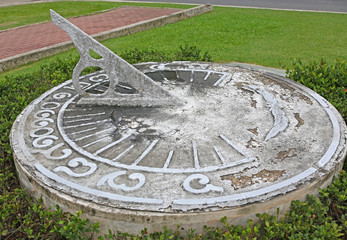 antique sundial decorating a garden