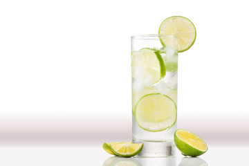 Full glass of water with lemon and mint isolated on white background
