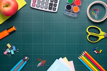 Back to school supplies. Books and chalkboard.