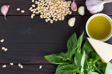 Ingredients for pesto sauce on a wooden table