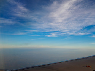 Fototapeta na wymiar Evening sky, on the fly, wing of the plane