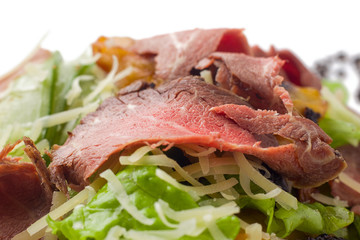 meat salad with roast beef, mushrooms, vegetables and cheese on white background, isolated