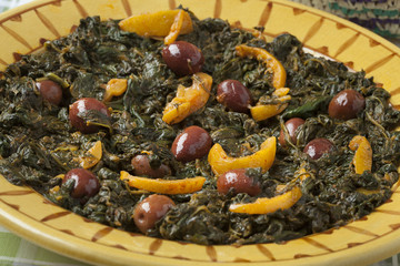  Moroccan dish with spinach, olives and preserved lemon