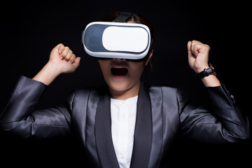 Asian woman wearing VR technology with business suit