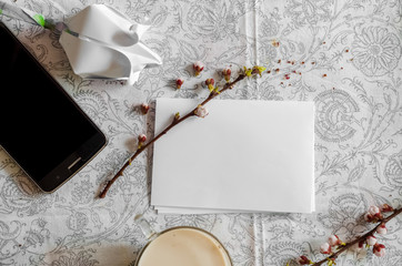 White list. Phone for communication. Spring branches.