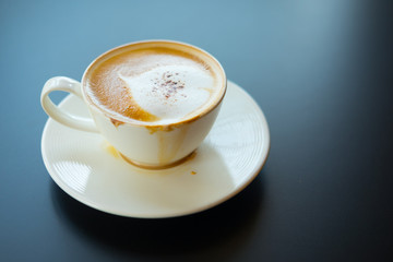hot coffee with foam milk art of love