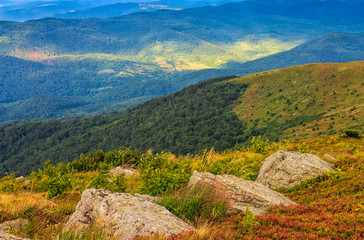 Naklejka premium huge stones on the meadow on top of mountain ridge