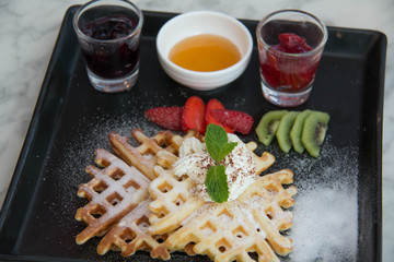  waffles with strawberry, cherry, blueberry and frurt