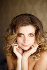 Fototapeta premium young beautiful woman with long curly hair