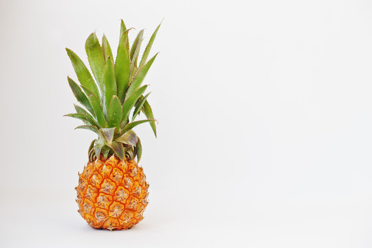 Exotic fruit baby pineapple isolated on white background. Healthy eating dieting food.