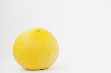 Exotic fruit pomelo or citrus maxima isolated on white background. Healthy eating dieting food.